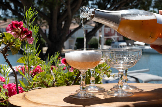 Summer party, French brut rose champagne sparkling wine in coupe glasses in yacht harbour of Port Grimaud near Saint-Tropez, French Riviera vacation, Var, France