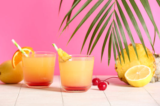 Glasses of tasty mai tai cocktail on table