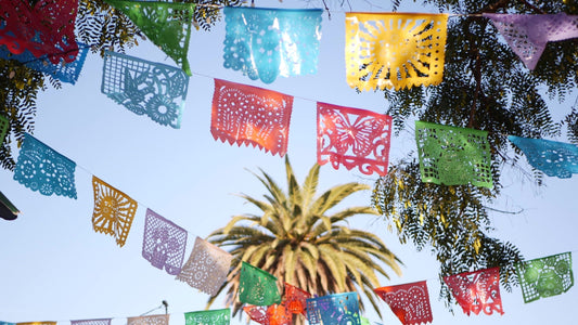 Colorful mexican perforated papel picado banner, festival colourful paper garland. Multi colored hispanic folk carved tissue flags, holiday or carnival. Authentic fiesta decoration in Latin America