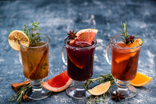Various autumn or winter seasonal alcohol hot cocktails - mulled wine, grog, warm ginger ale, hot rum, punch, mulled apple cider