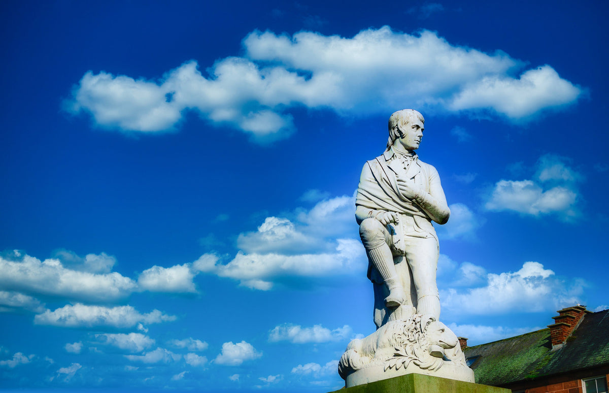 Robbie Burns statue on blue sky at Dumfries, Scotland.